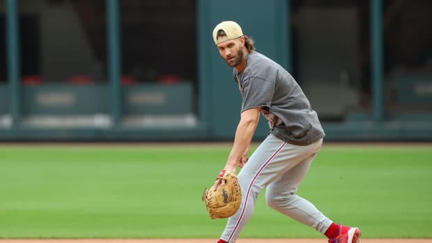 Oct 6, 2023; Atlanta, GA, USA; Philadelphia Phillies first baseman Bryce Harper (3) fields a ground ball during a workout before the NLDS against the Atlanta Braves at Truist Park. Mandatory Credit: Brett Davis-USA TODAY Sports